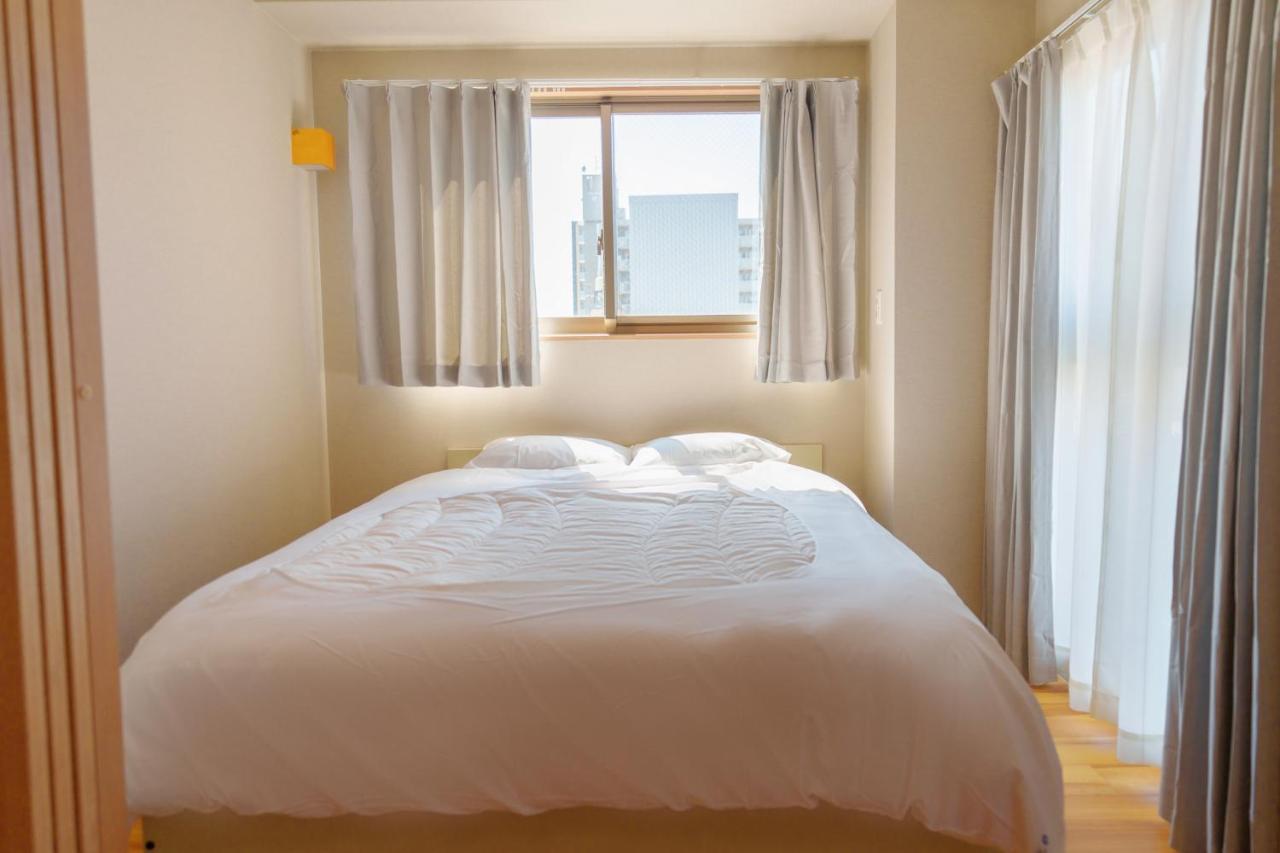 Dc桜の苑601洋室双人床 Hotel Oszaka Kültér fotó
